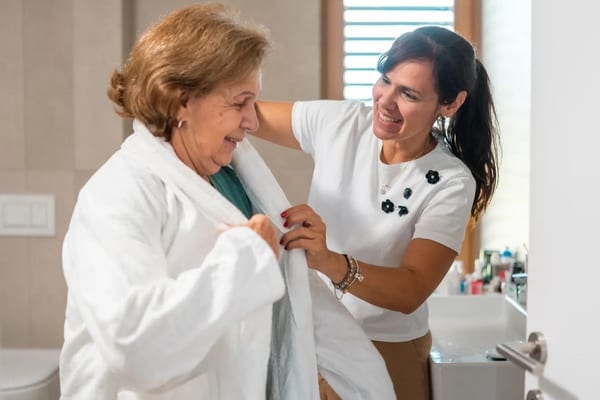 Caregiver providing safe and respectful bathing assistance